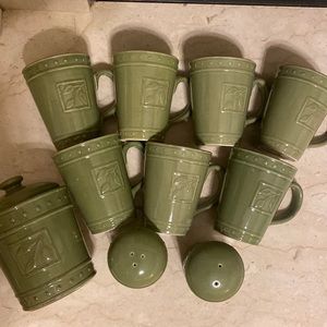 Green stoneware mugs, canister and salt and pepper shaker